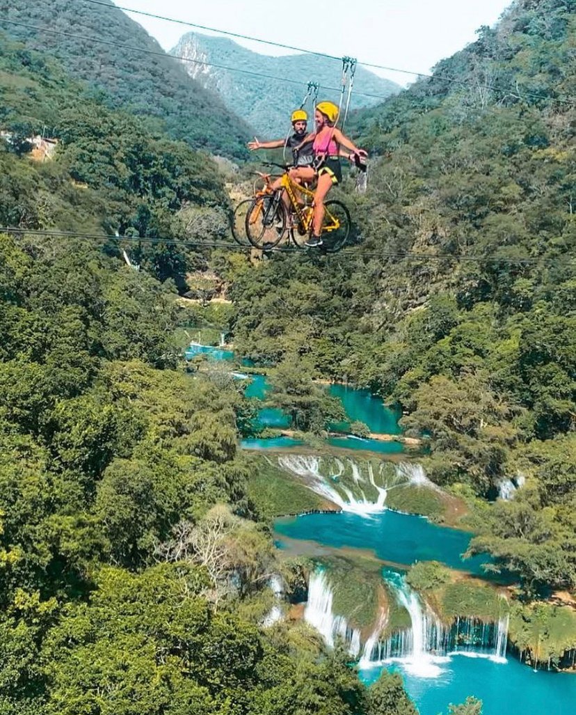 biking over waterfalls, travel to Mexico right now