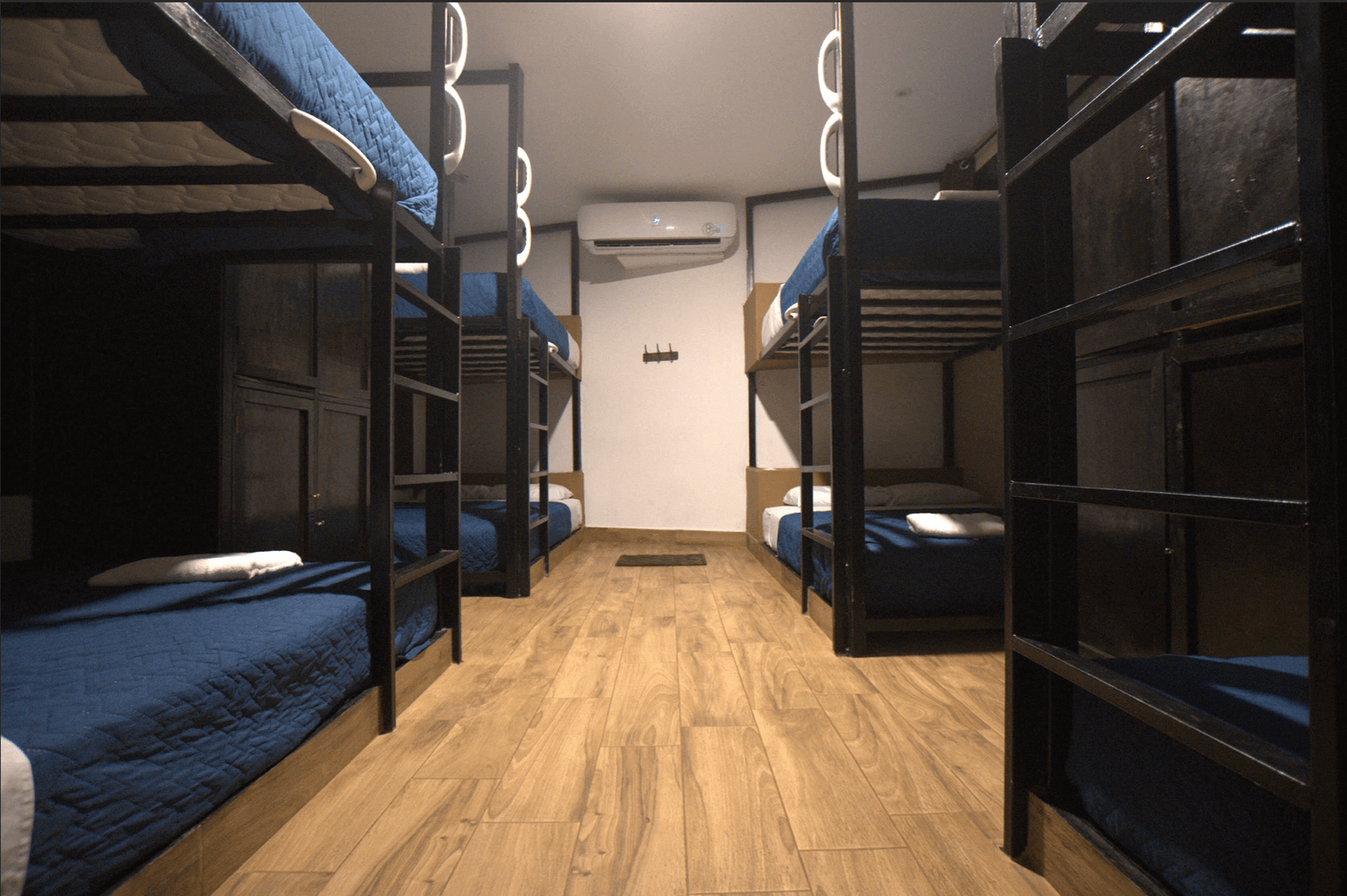 stay in a hostel, Ways to Be a More Eco-Friendly Traveler in 2023