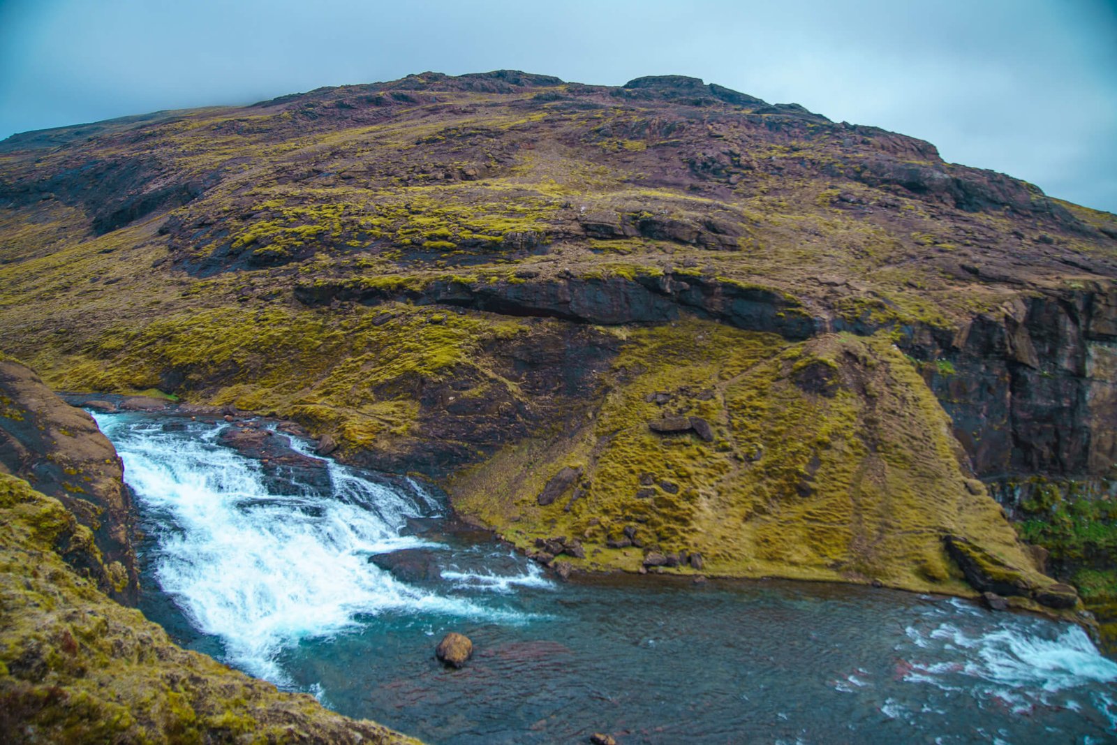top of Glymur waterfall in Iceland