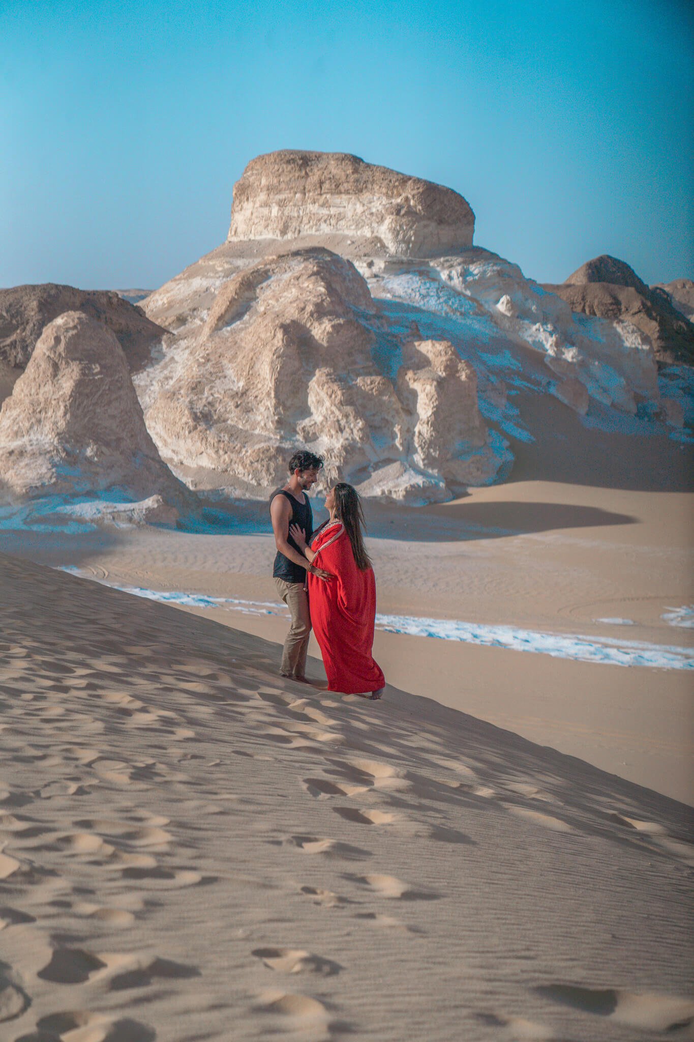 sand boarding on the sand dunes of the White desert in Egypt