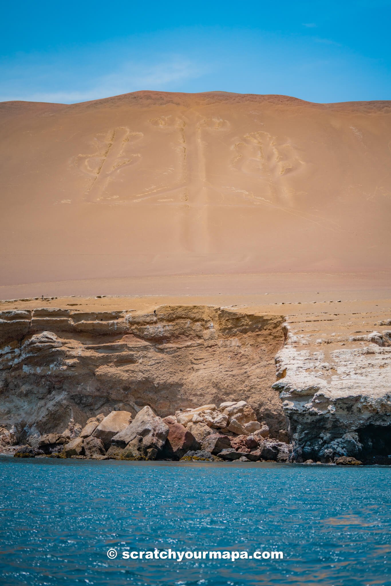 view of the Candelabria from the boat on the Islas Ballestas tour in Paracas, Peru