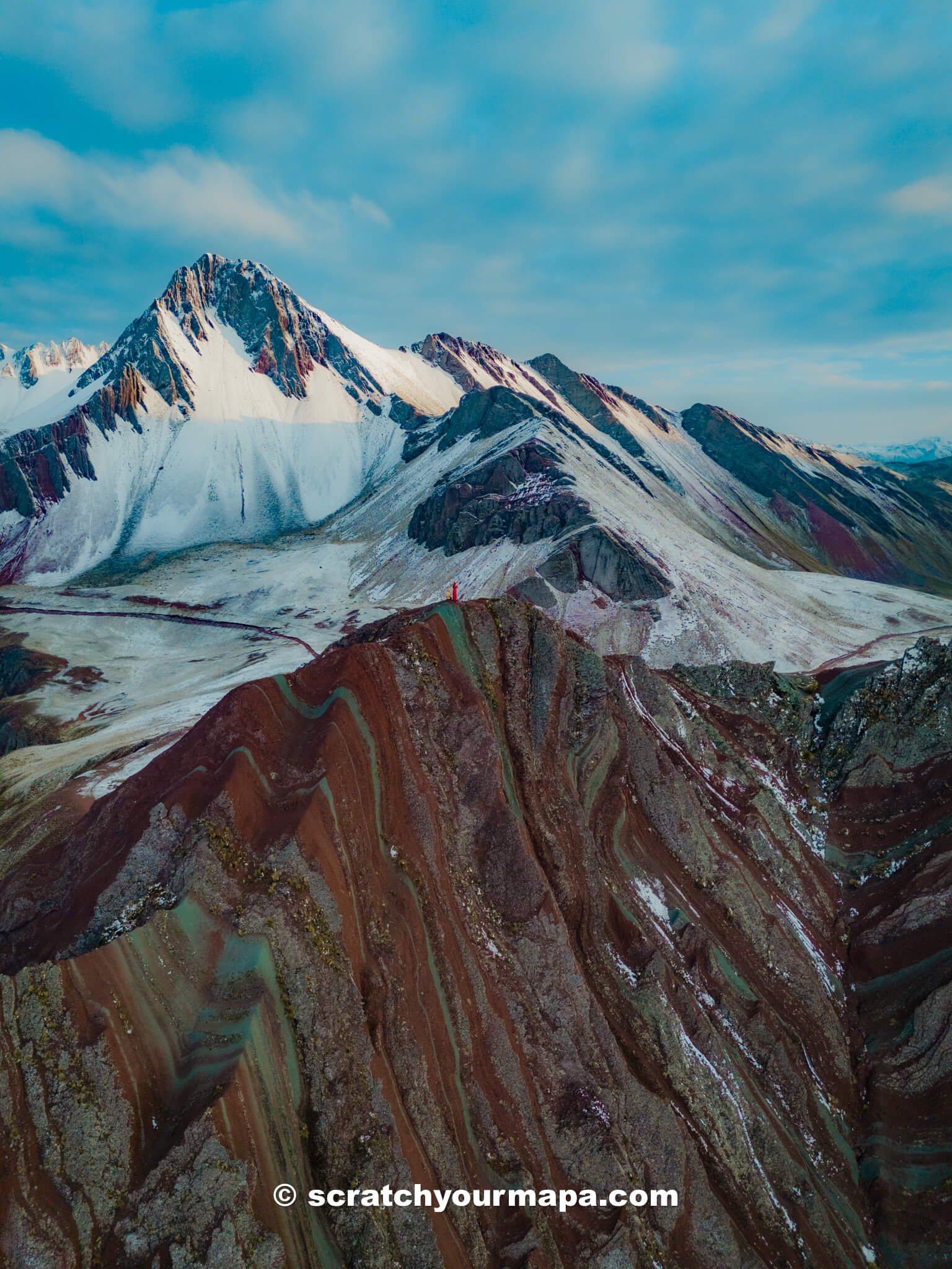 snow at Pallay Punchu rainbow mountain in Peru