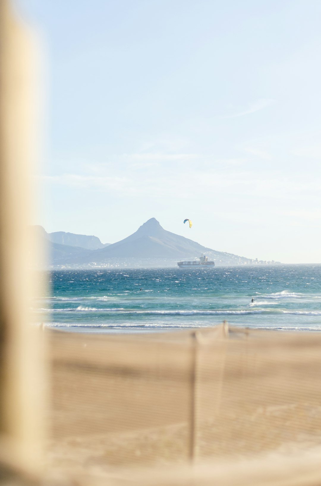 a view of a beach with a mountain in the distance