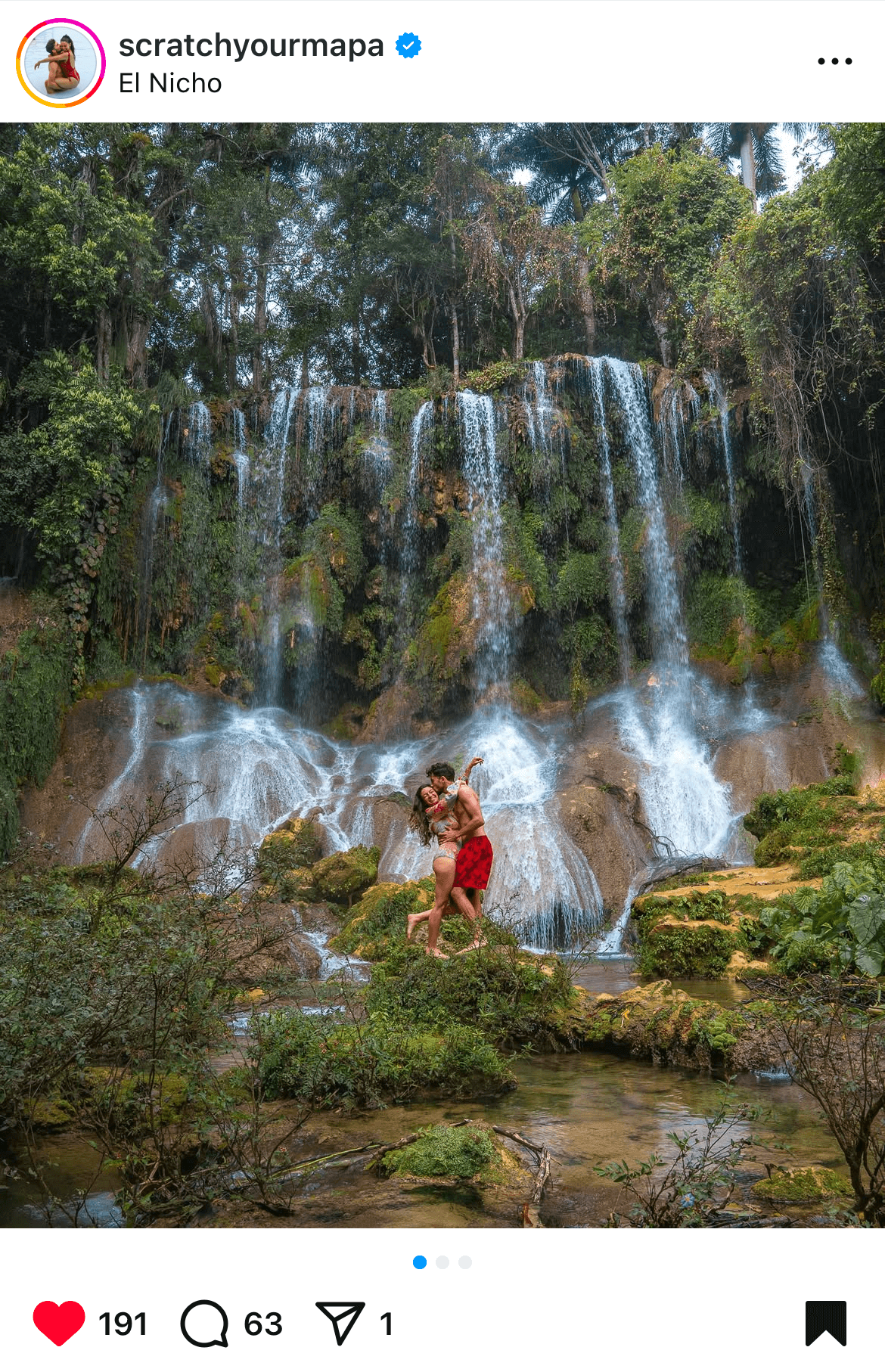 Instagram post by Scratchyourmapa of a traveling couple at El Nicho Waterfall in Cuba, which is one of the top things to do in Trinidad