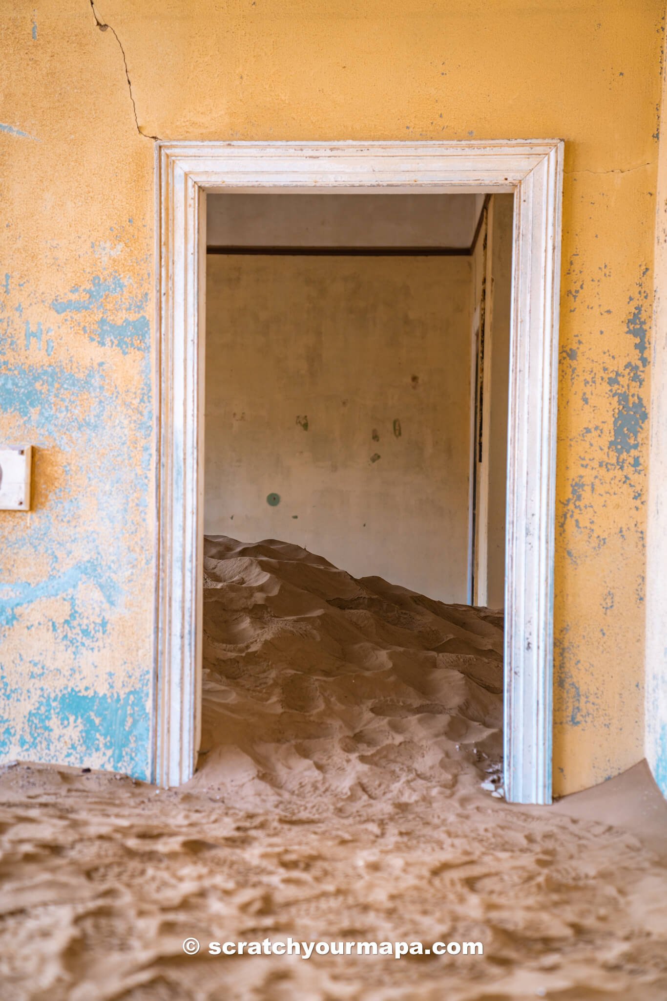 abandoned building in the Kolmanskop ghost town of Namibia