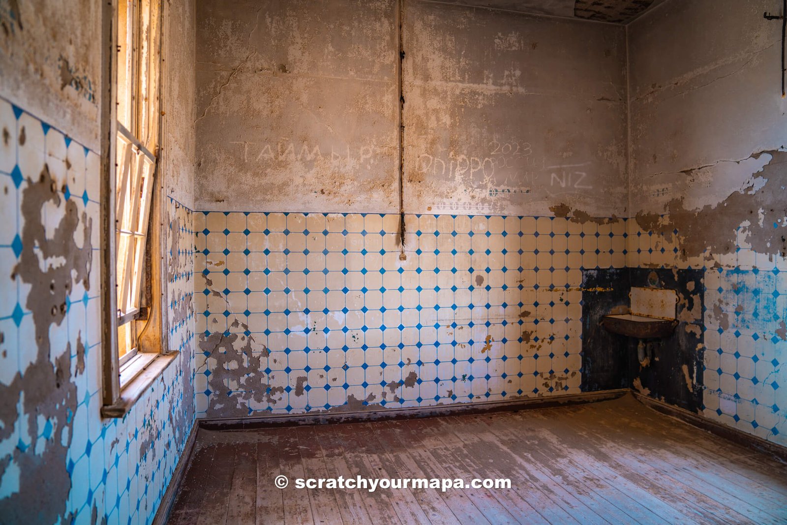 abandoned building in the Kolmanskop ghost town of Namibia