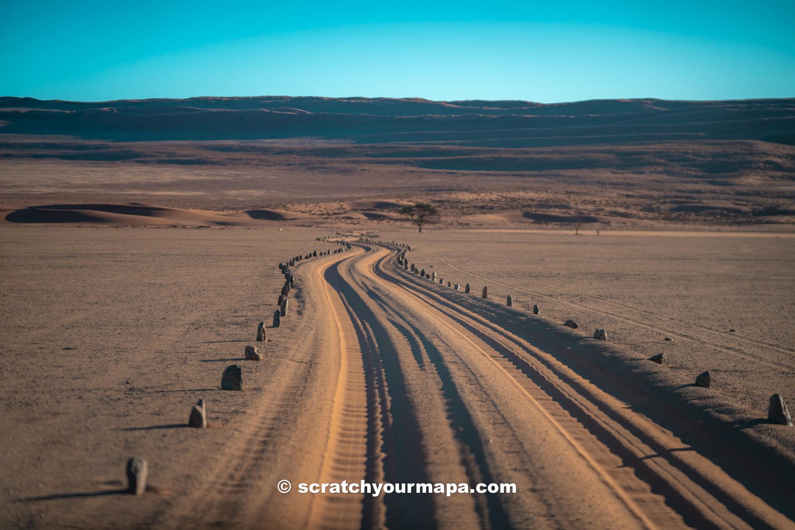driving in thick sands on a southern Africa road trip