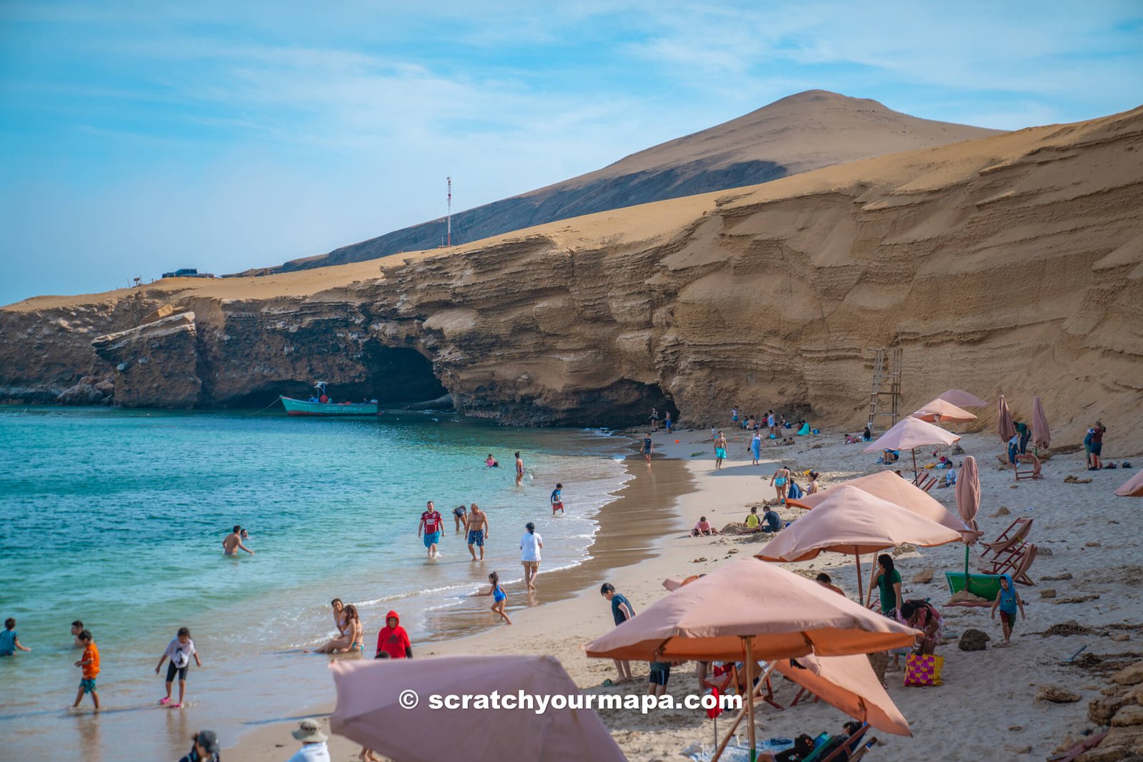 crowds at Playa Raspon in Paracas National Reserve, Peru